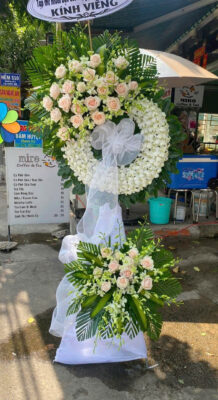Floral wreath with white roses and greenery